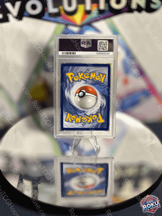 Pikachu SV Promo Pokémon Card graded PSA 9 displayed on reflective surface, showcasing iconic Poké Ball design.