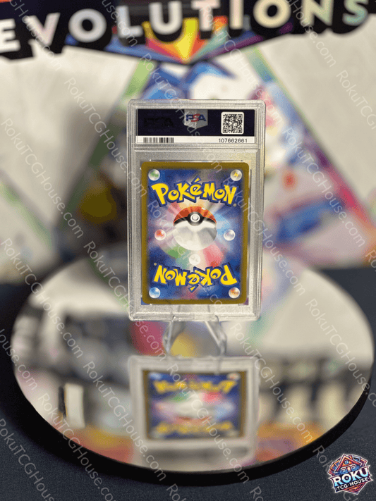 Iron Crown EX Pokémon card displayed in PSA 9 grade with striking blue background, reflecting collectible elegance.