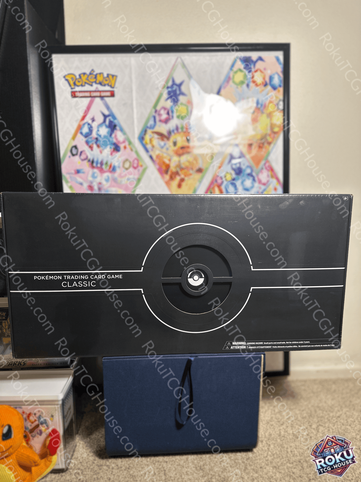 Box of Pokémon TCG: Trading Card Game Classic with vibrant background and accessories for gameplay.
