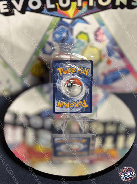 PokeBall Pokémon card from evolutions series, displayed on a mirror with colorful background, ideal for collectors.