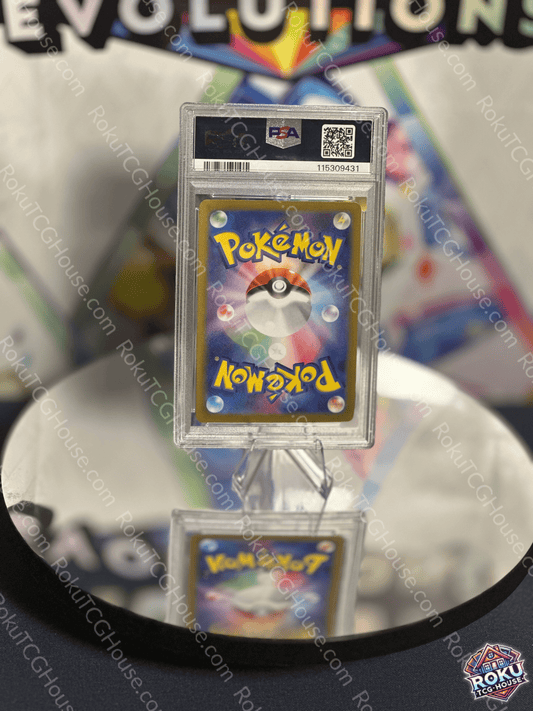 Reverse side of PSA 8 graded Pokémon card featuring iconic Poké Ball design and vibrant colors.