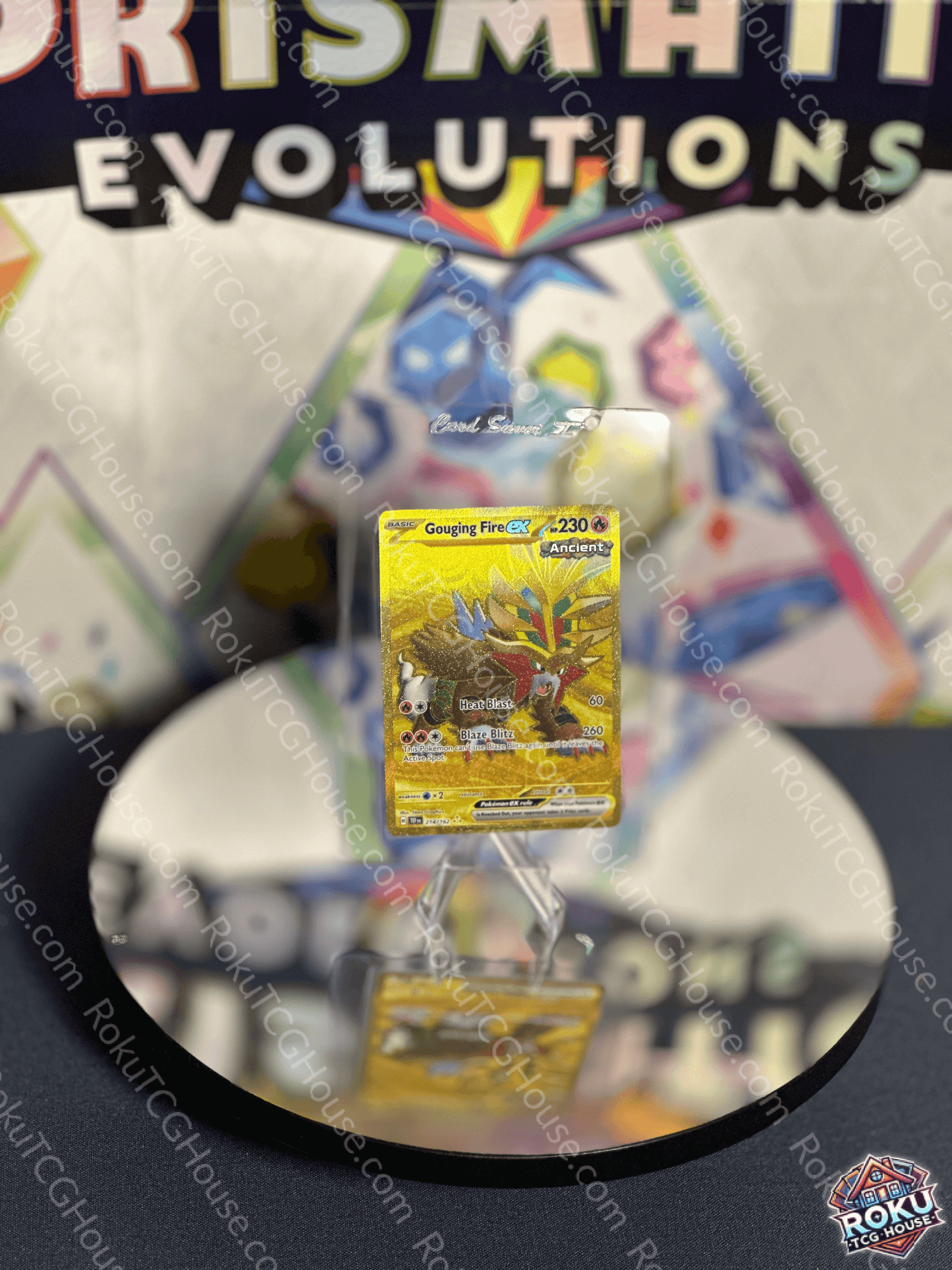 Gouging Fire EX Temporal Forces Pokemon Card displayed on reflective surface with colorful background.