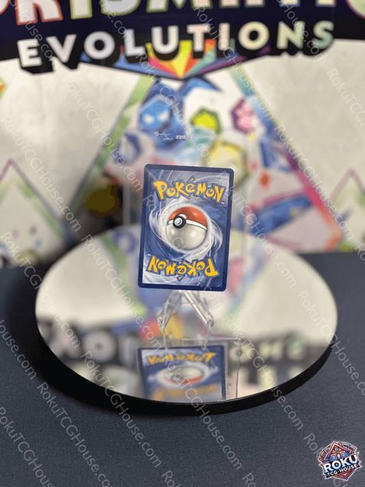Gouging Fire EX Pokémon card displayed on a reflective surface, showcasing iconic design from Temporal Forces set.