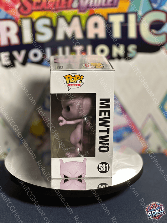Mewtwo Funko Pop! Vinyl Figure #581 in collectible box against a colorful background.