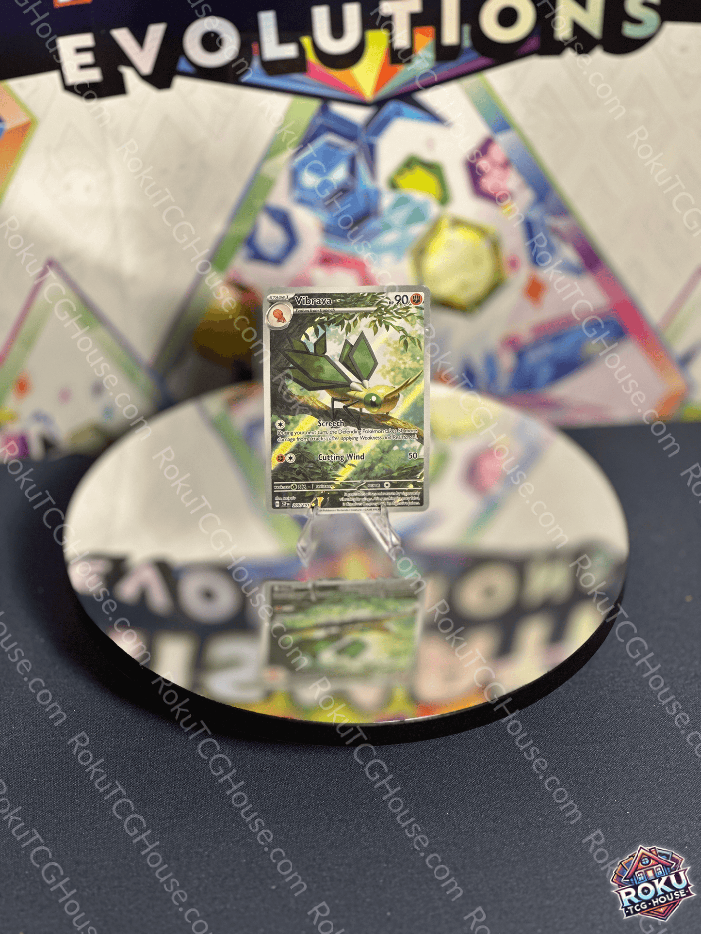 Vibrava Surging Sparks Pokemon card displayed on a reflective surface, showcasing vibrant artwork and condition.