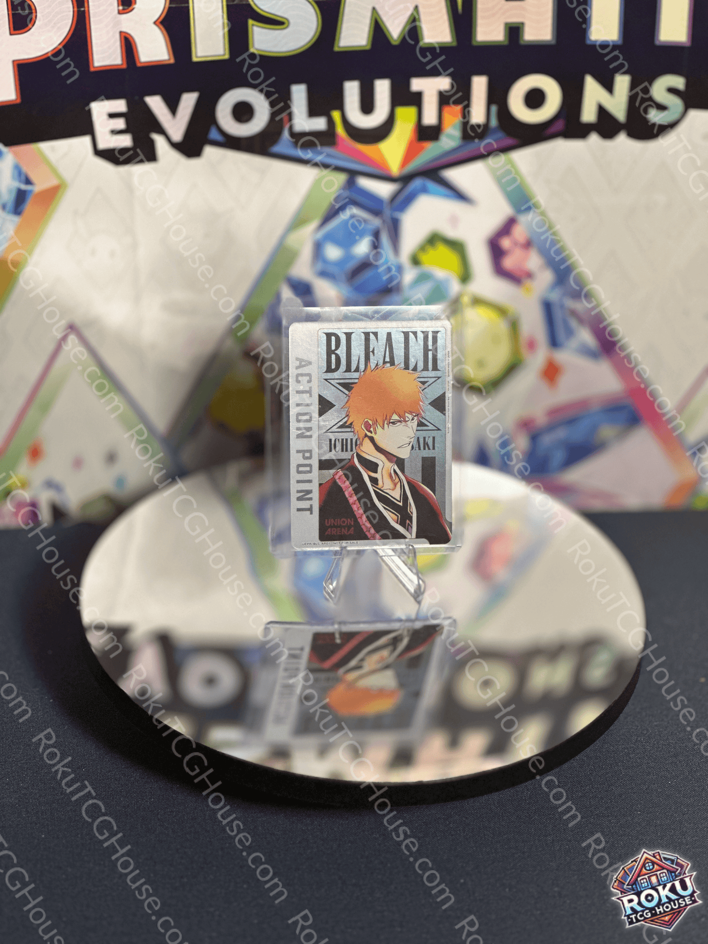 Ichigo Kurosaki Action Point card from Bleach series on a reflective surface, showcasing vibrant trading card design.