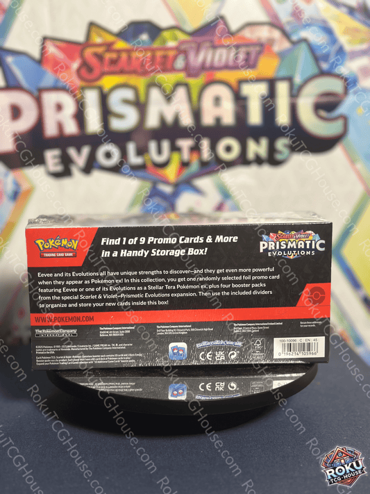 Back of Prismatic Evolutions - Surprise Box listing contents including four packs and a stamped Eeveelution promo