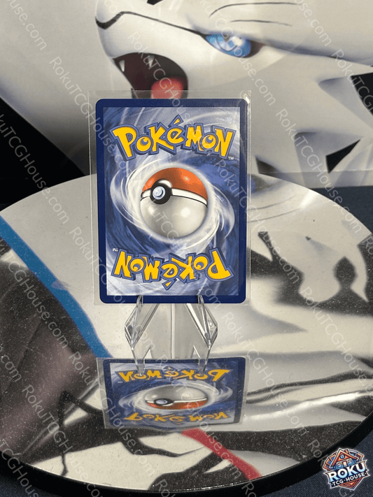 Pokémon card featuring a Poké Ball on a reflective surface, showcasing vibrant artwork with a blue background.