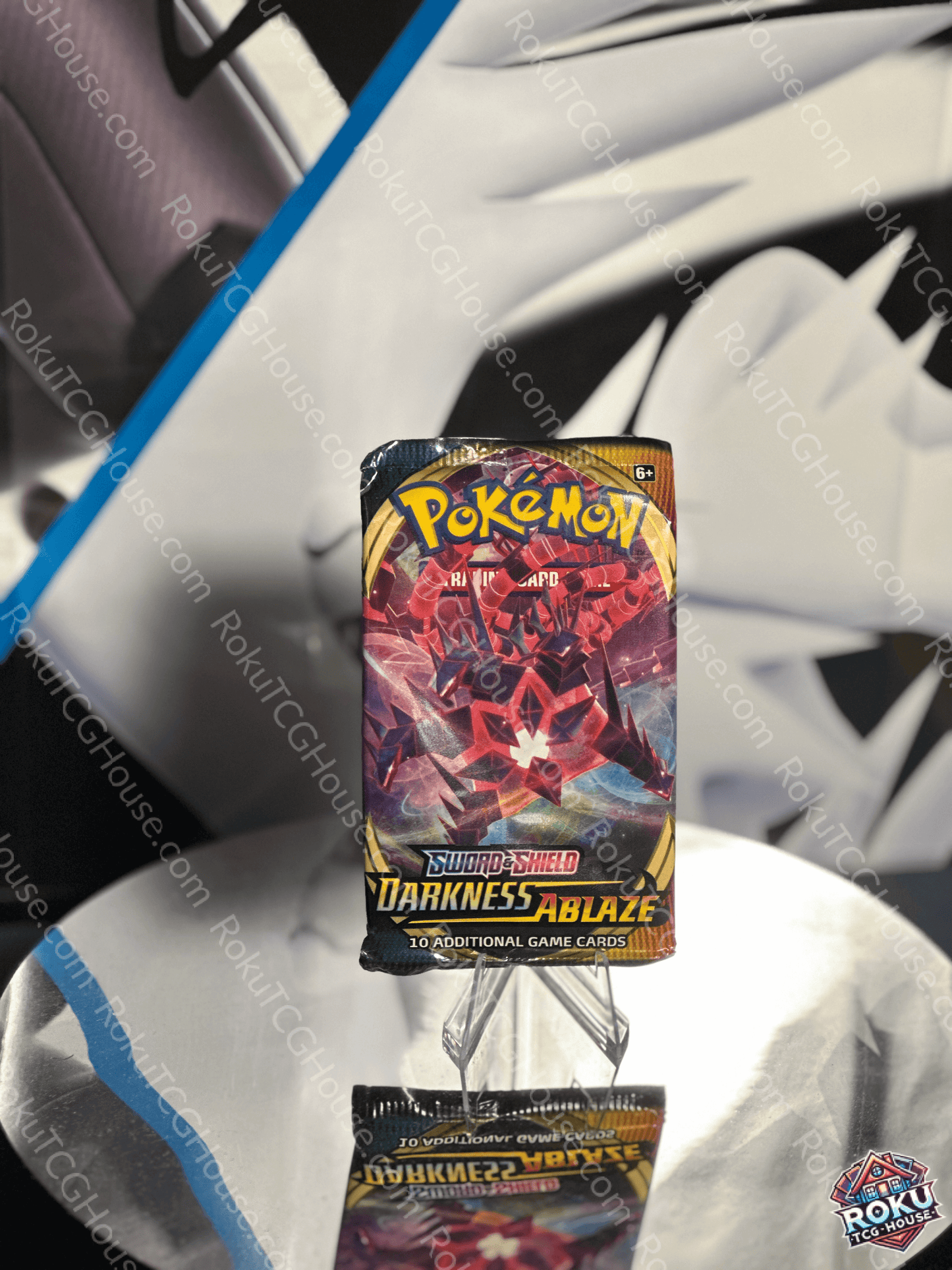 Pokemon TCG Darkness Ablaze Booster Pack featuring Charizard VMAX and Eternatus VMAX
