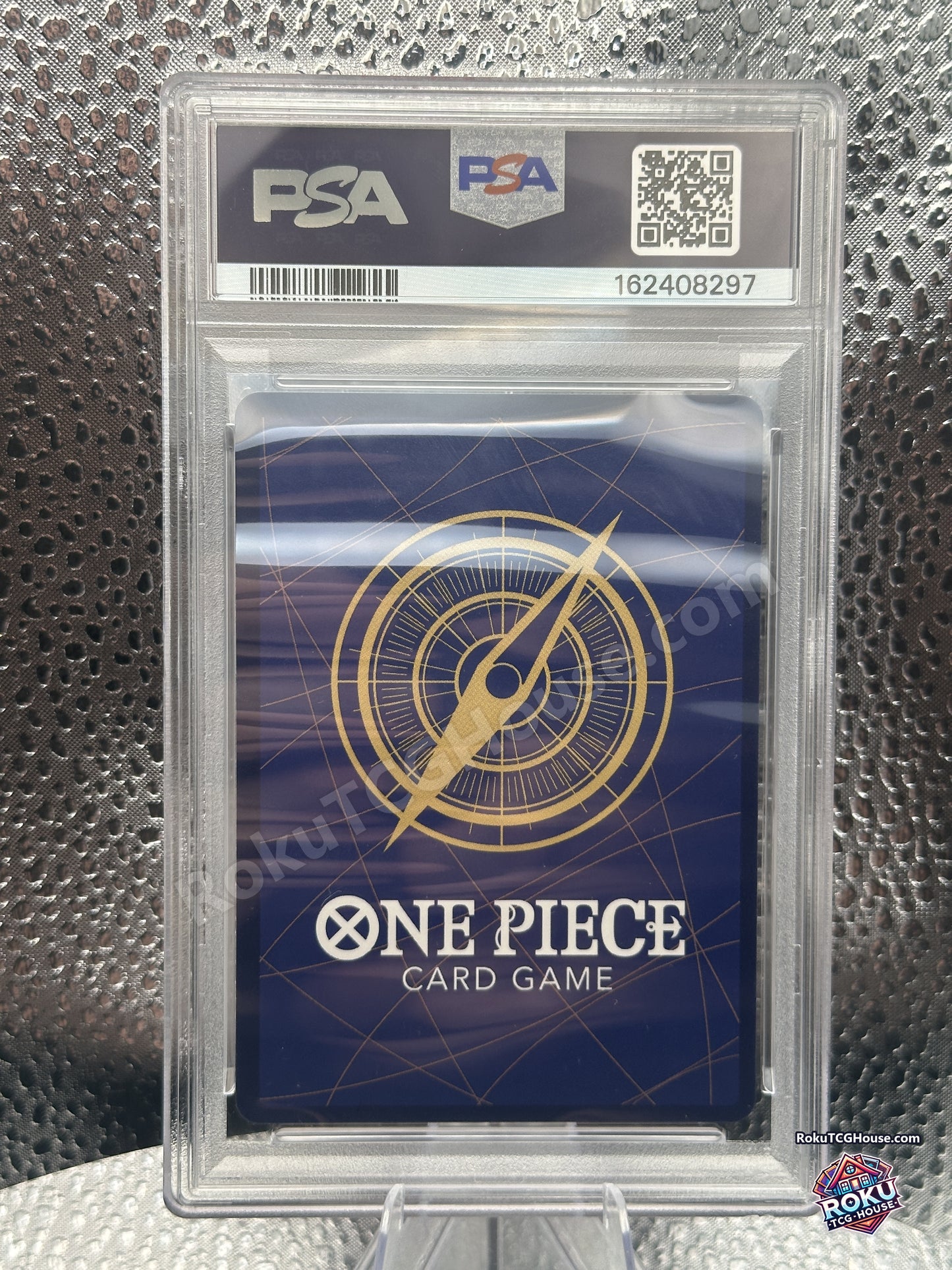 Back of PSA 10 slab showing One Piece Card Game card back and PSA cert 162408297