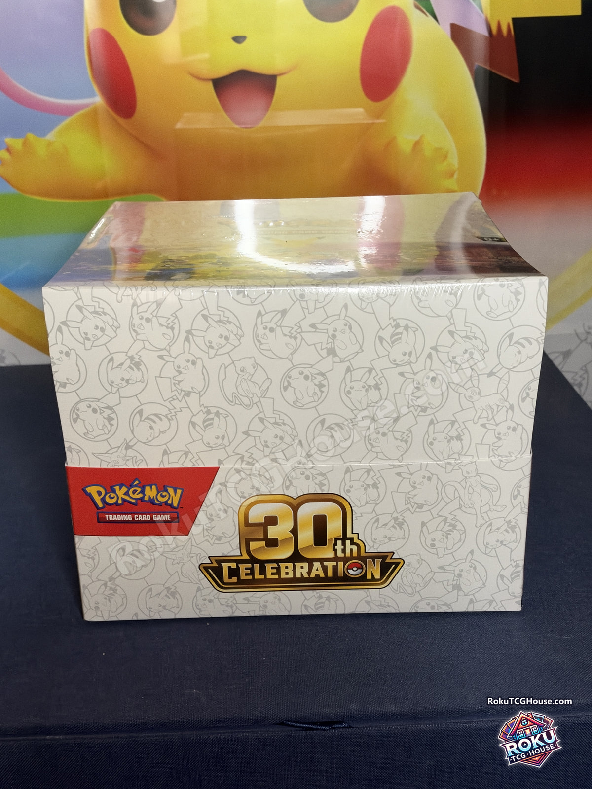 Front of the sealed Pokemon TCG 30th Celebration Mini Tin Display