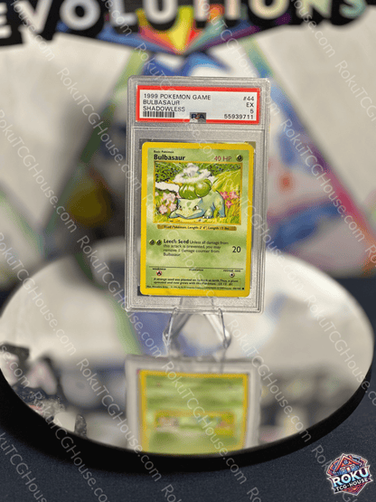 Bulbasaur Shadowless Base Set Pokemon Card PSA 5 displayed on a reflective surface for collectors.
