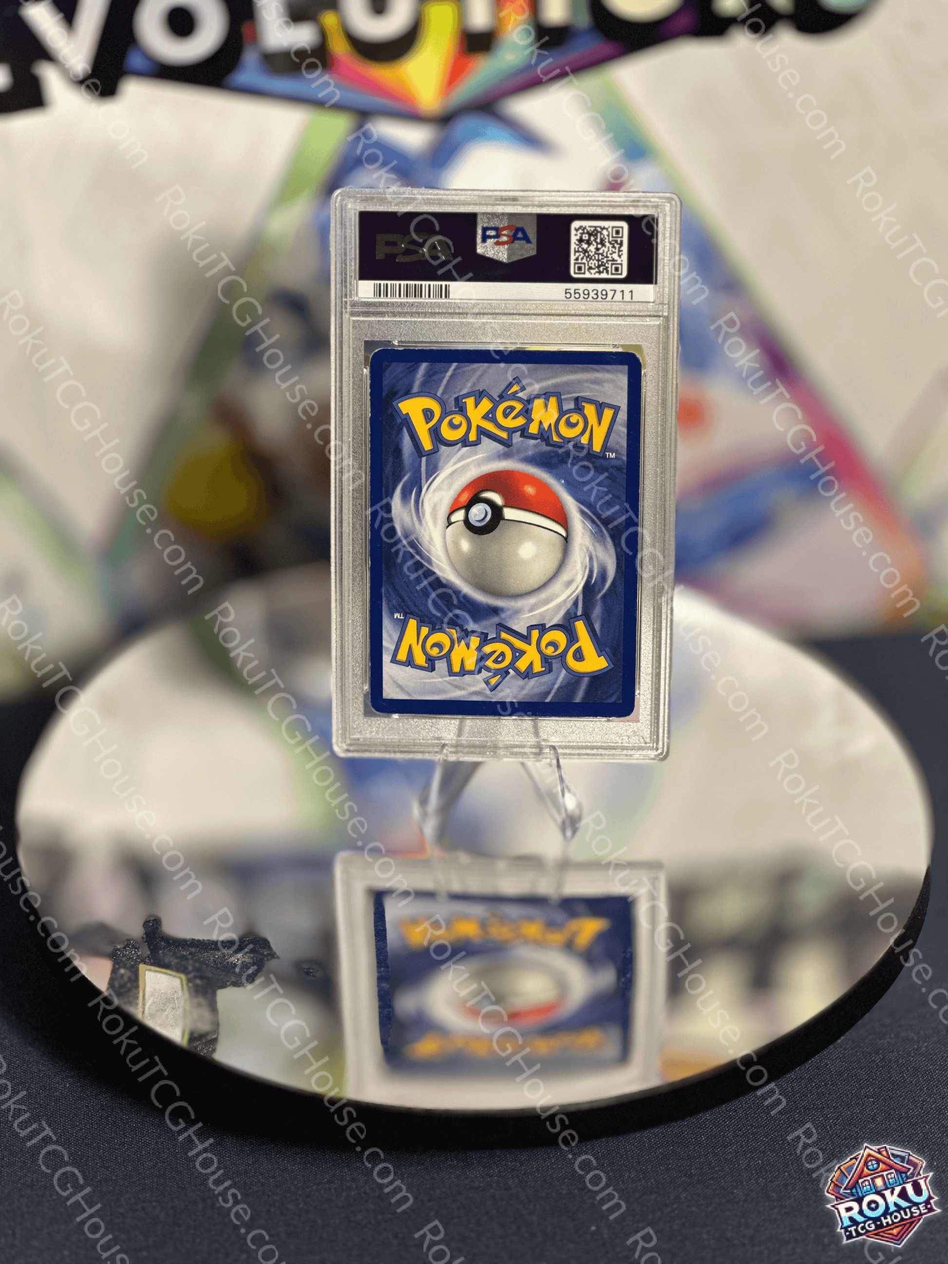 Back of a PSA-graded Pokémon card showing the Pokéball and logo, reflective surface display.