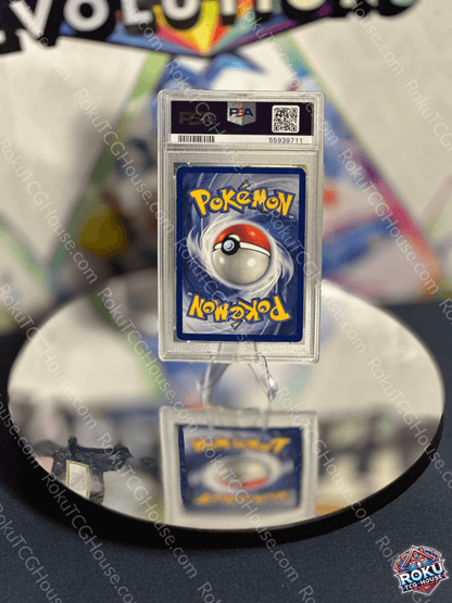 Back of a PSA-graded Pokémon card showing the Pokéball and logo, reflective surface display.