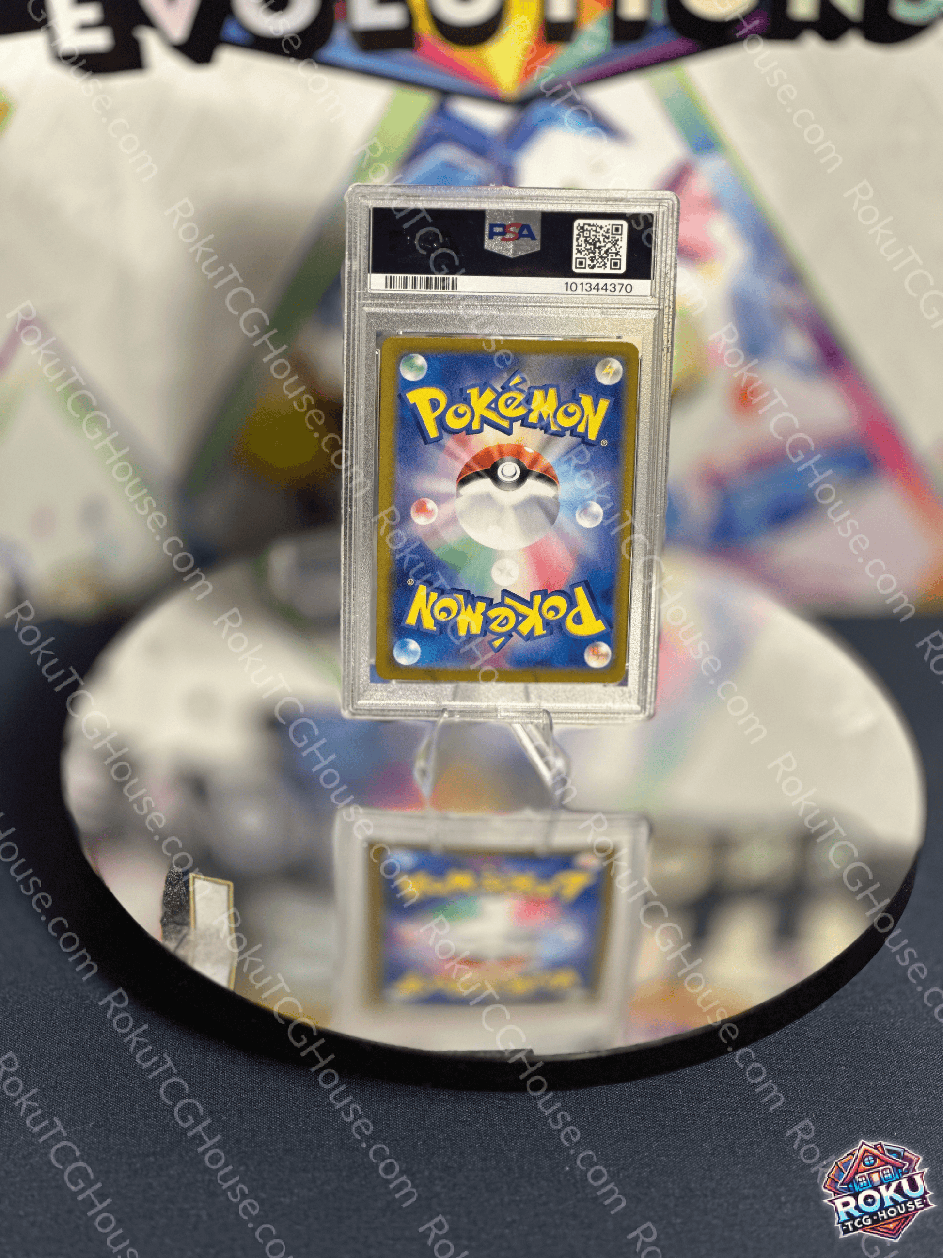 Alolan Exeggutor Paradise Dragona Pokémon card in PSA 10 condition displayed on a mirrored surface.