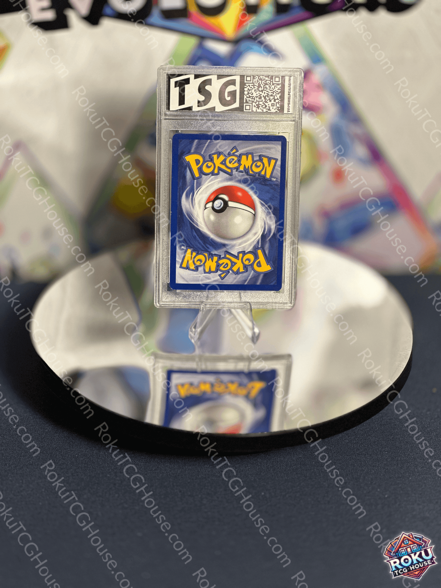 Horsea Neo Genesis Pokemon card graded TSG 7 displayed on a reflective surface, showcasing nostalgic artwork.