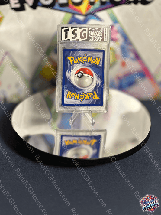 Horsea Neo Genesis Pokemon card graded TSG 7 displayed on a reflective surface, showcasing nostalgic artwork.