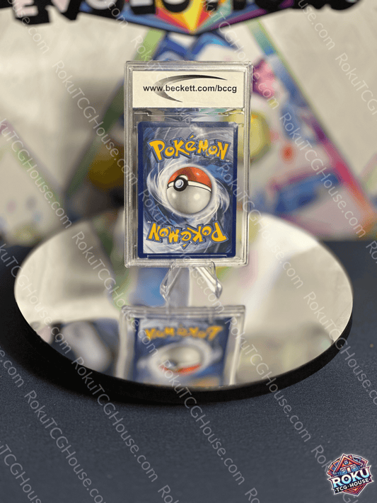 Pokémon card showcasing the iconic Poké Ball design, displayed on a reflective surface.