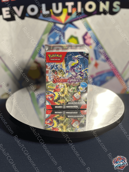 Scarlet & Violet: Base Booster Bundle displayed on a round table, featuring 6 booster packs for Pokémon card collectors.