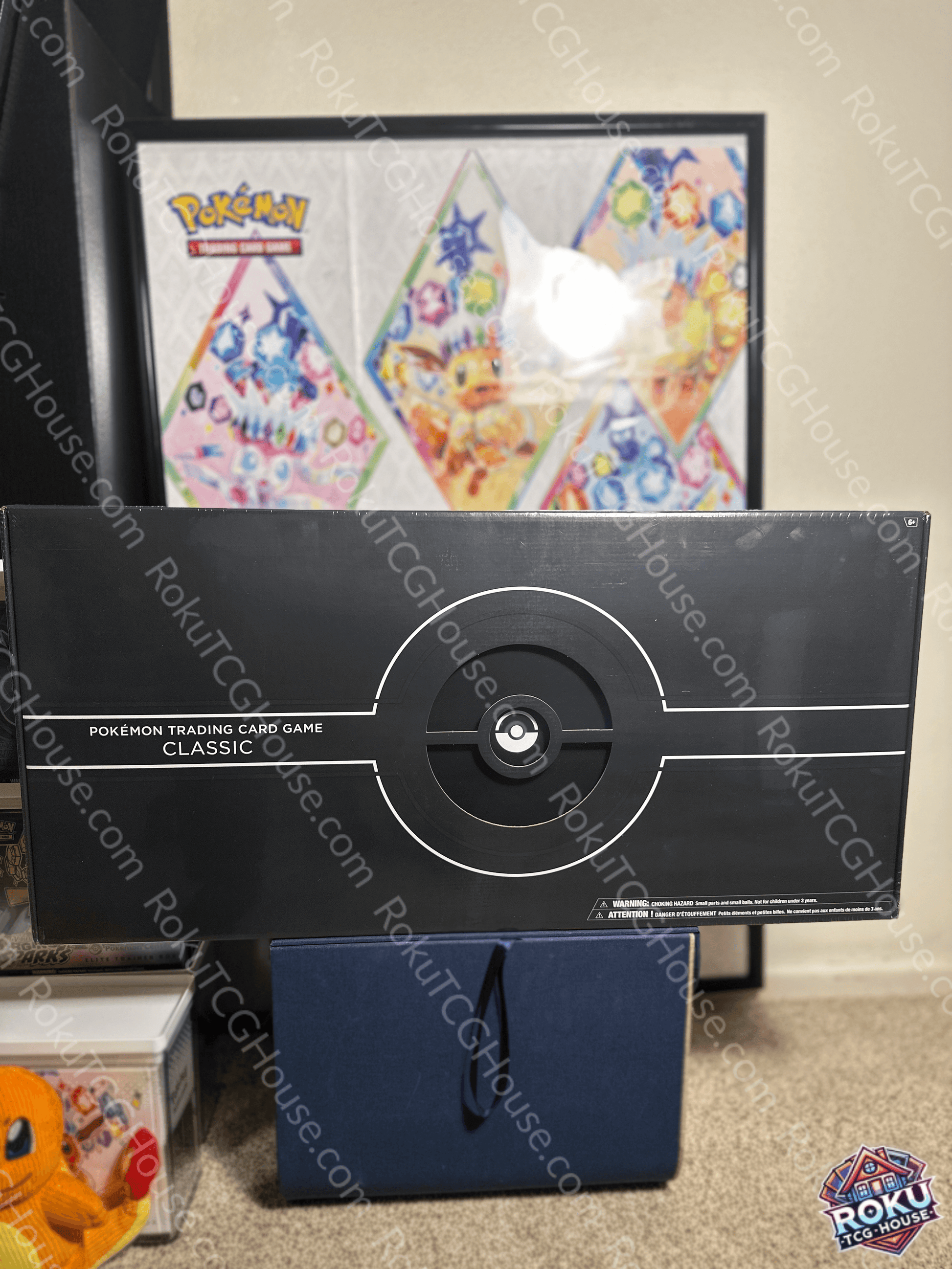 Box of Pokémon TCG: Trading Card Game Classic with vibrant background and accessories for gameplay.