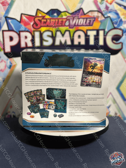 Twilight Masquerade Elite Trainer Box display showcasing cards, accessories, and promotional materials from Pokémon TCG.