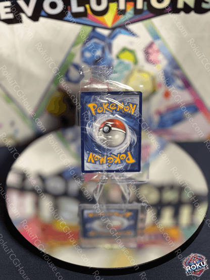 PokeBall Pokémon card from evolutions series, displayed on a mirror with colorful background, ideal for collectors.