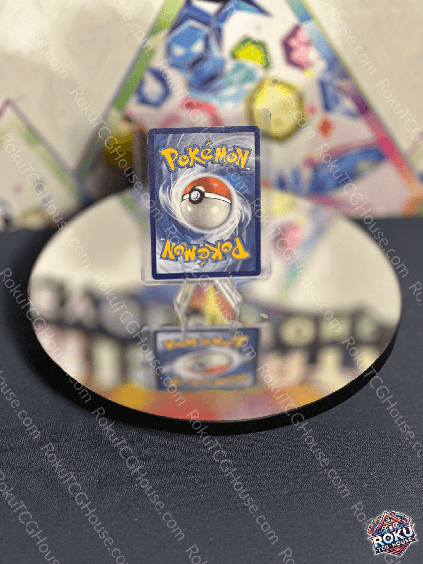 Reflection of a Pokémon card on a mirror, showcasing the iconic Poké Ball design.