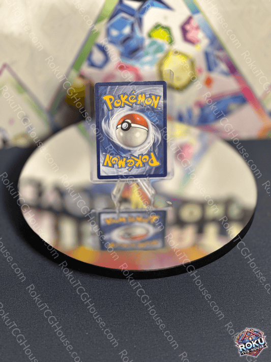 Reflection of a Pokémon card on a mirror, showcasing the iconic Poké Ball design.
