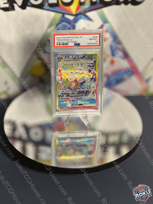 Terapagos EX Pokemon card from Terastal Festival, graded PSA 10, displayed on a mirrored surface.