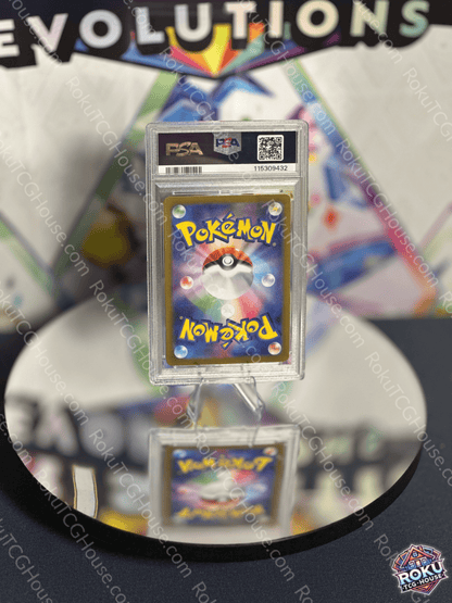 Terapagos EX Pokemon card from Terastal Festival, graded PSA 10, displayed on a reflective surface.
