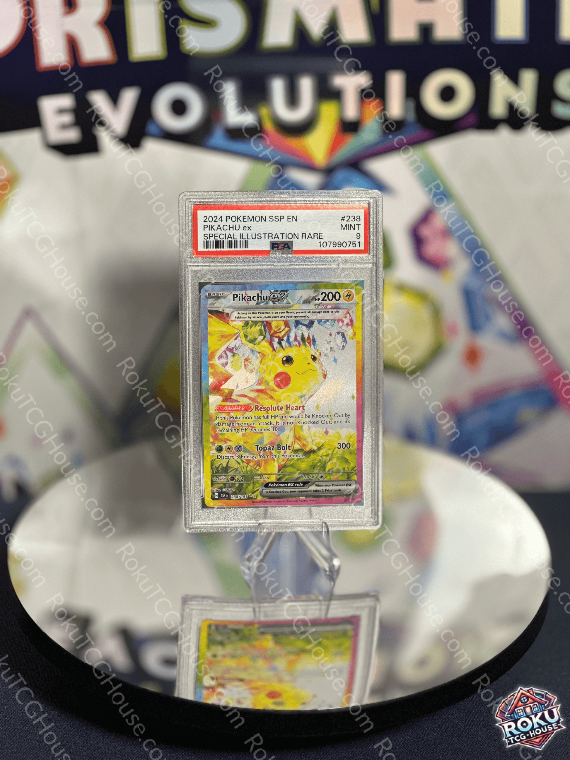 Pikachu EX (238/191) Pokémon card, PSA 9 graded, featuring Surging Sparks illustration on display.