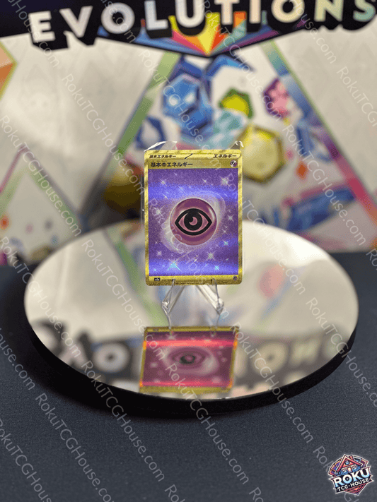 Gold Psychic Energy card from the Japanese SV: 151 set displayed on a reflective surface.