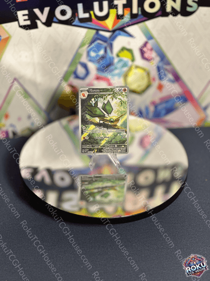Vibrava Surging Sparks Pokemon card displayed on a reflective surface, showcasing vibrant artwork and condition.