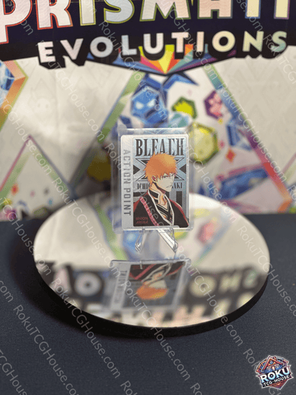 Ichigo Kurosaki Action Point card from Bleach series on a reflective surface, showcasing vibrant trading card design.