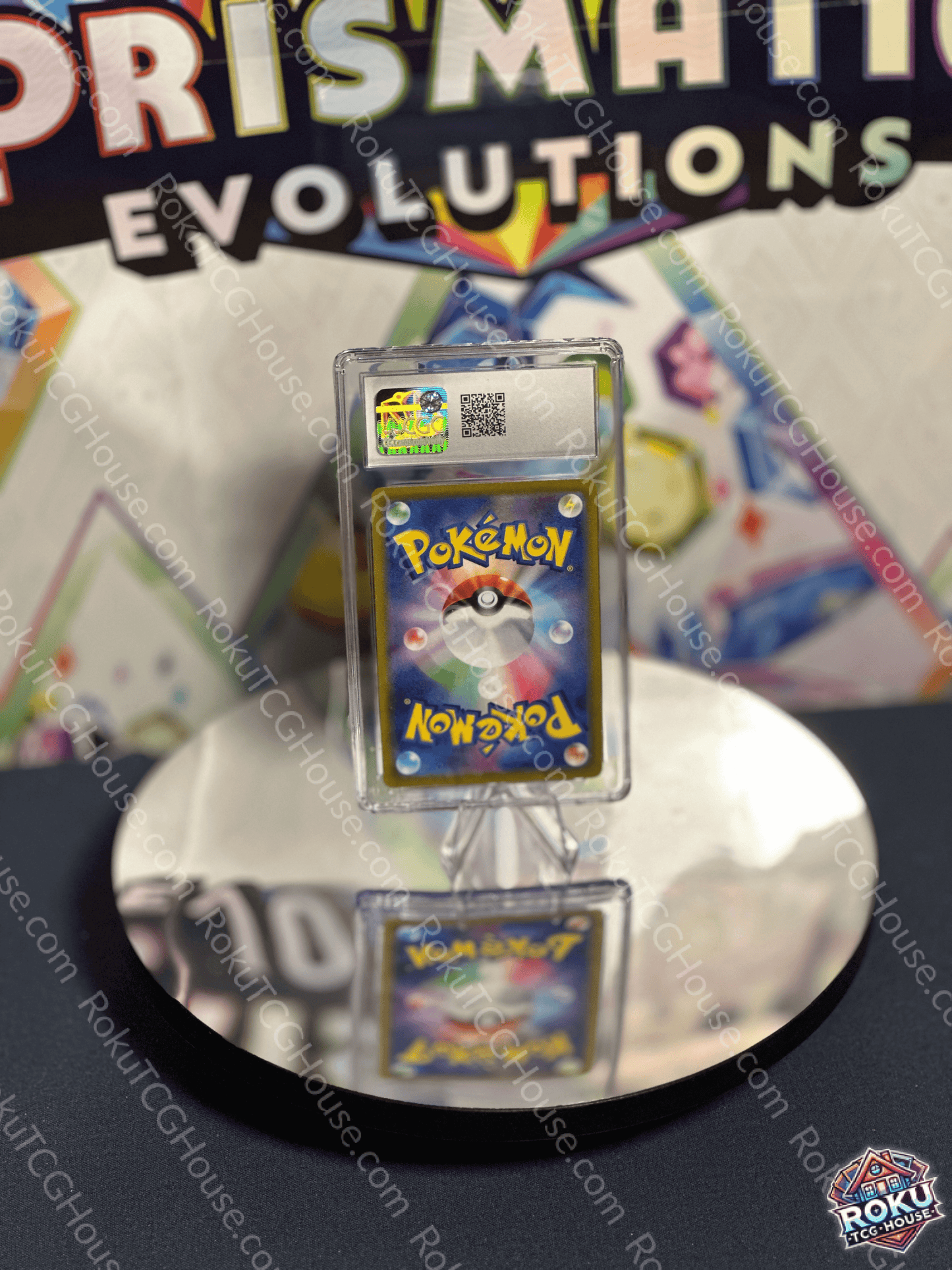 Miltank Pokémon card displayed in a protective case at a collector's event with a reflective surface.
