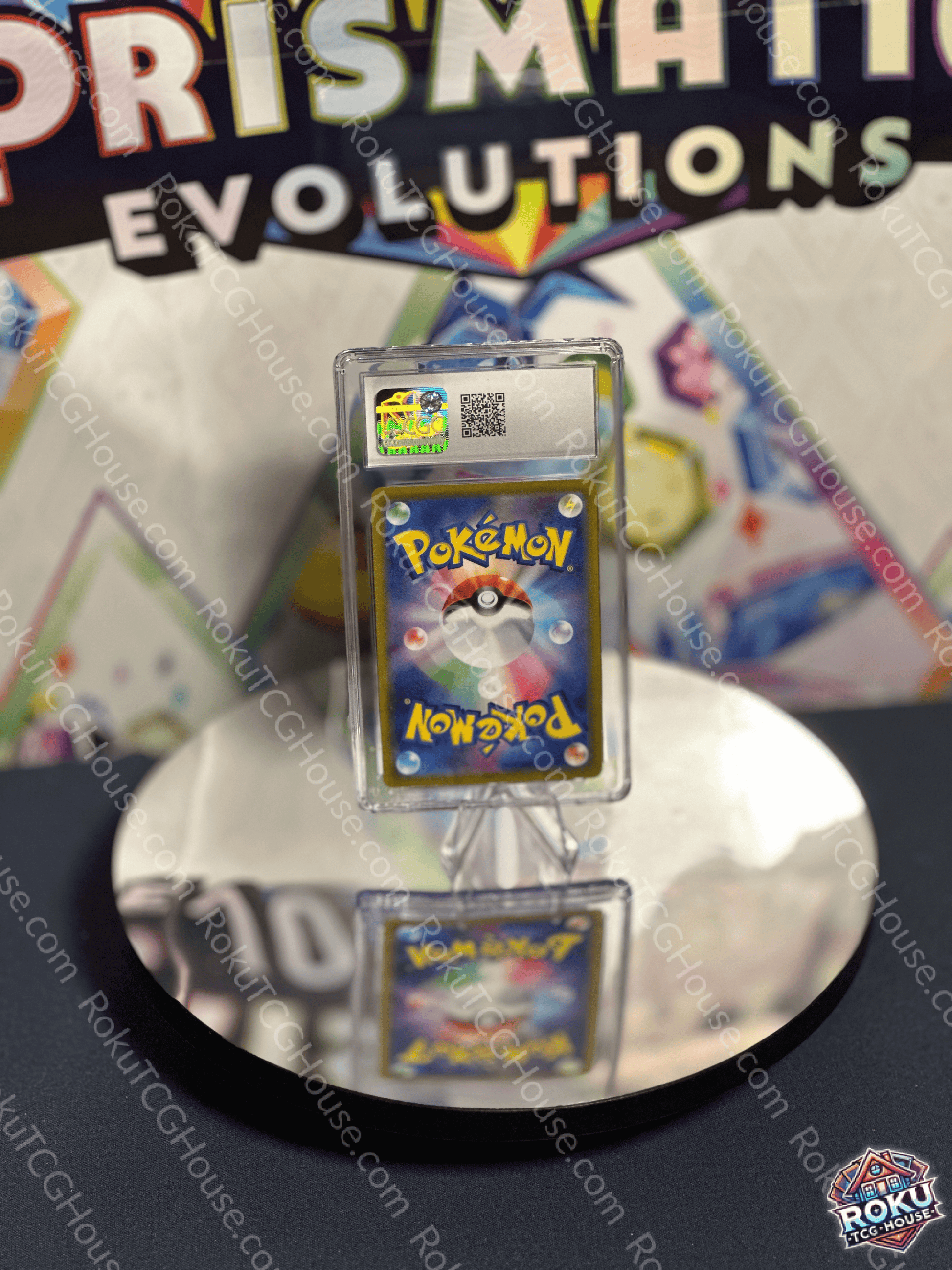 Miltank Pokémon card displayed in a protective case at a collector's event with a reflective surface.