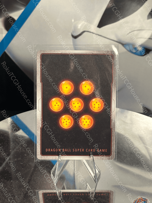 Frieza - Manga Booster 02 - Dragon Ball Super Card (NM) displayed on a stand with dragon balls.
