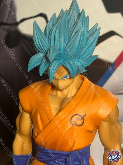 Super Saiyan Blue Goku Dragon Ball Super Figure in orange gi with blue hair and intense expression.