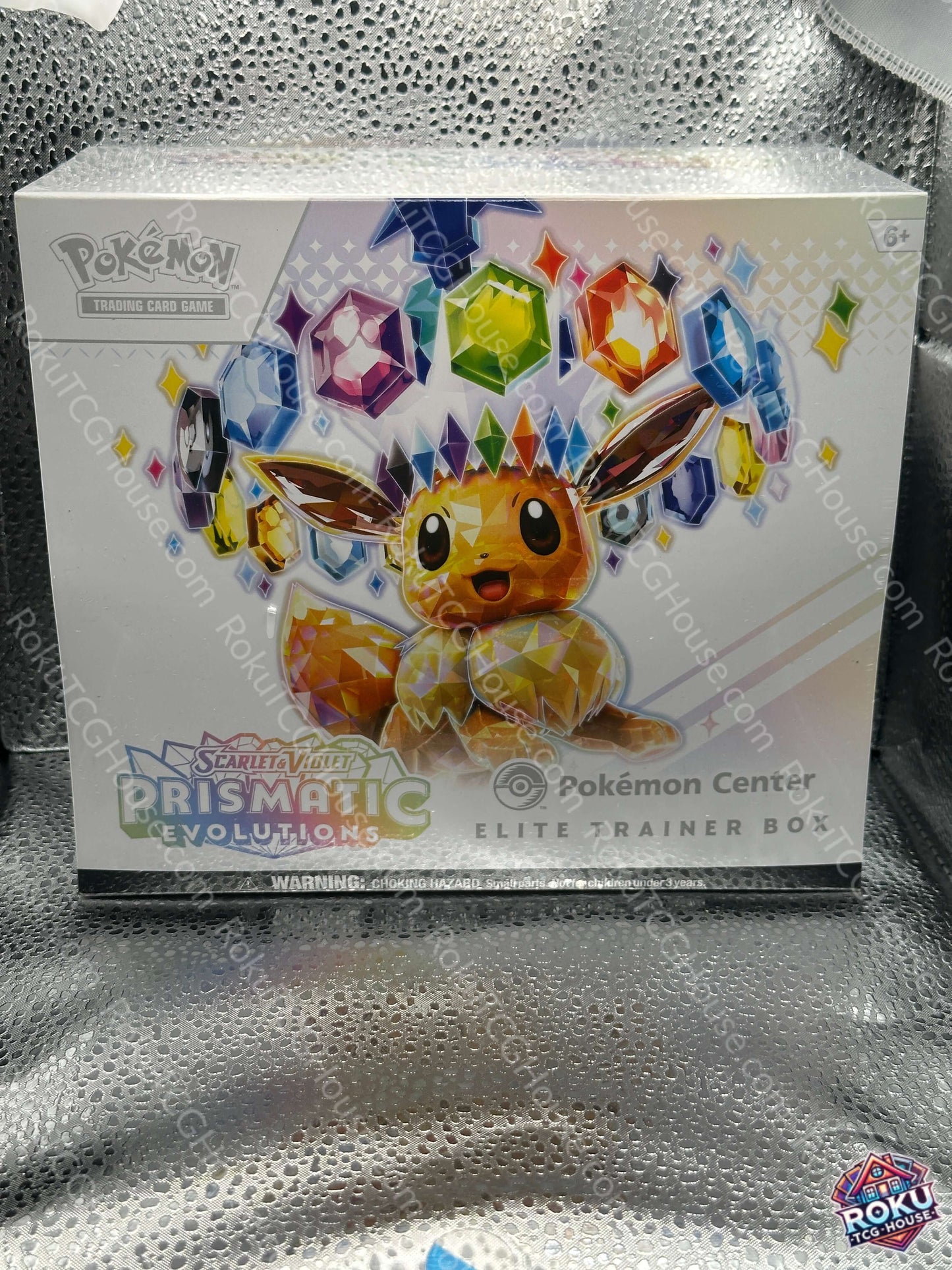 Prismatic Evolutions - Pokemon Center Elite Trainer Box *Small Rip*