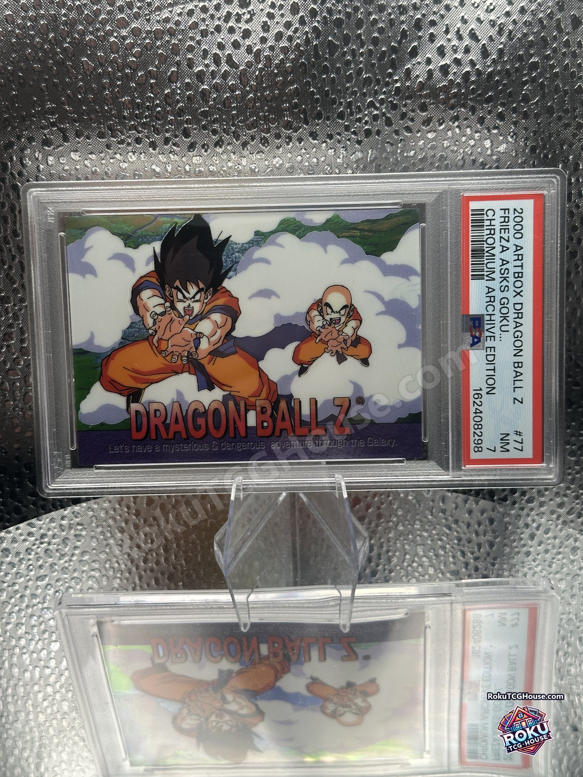 Angled view of the PSA 7 slab showing the chromium finish on Goku and Krillin
